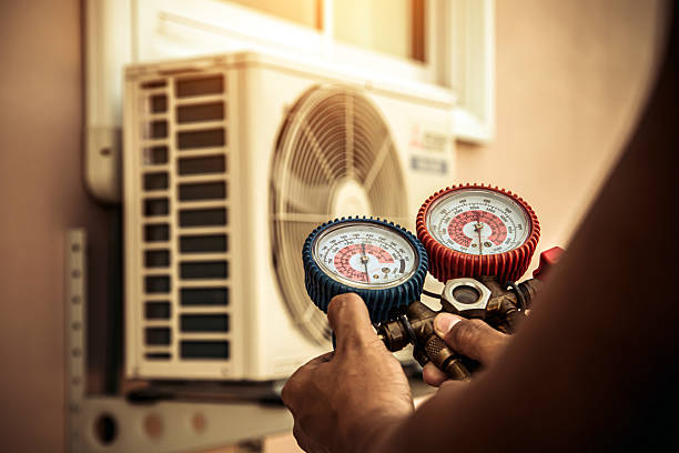 Professional Air Conditioning Service technician working in Fruitvale, CO